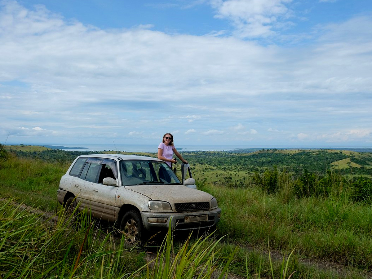 A Tourist Viewing wildlife in her Cheap Car Rental Uganda Toyota Rav4